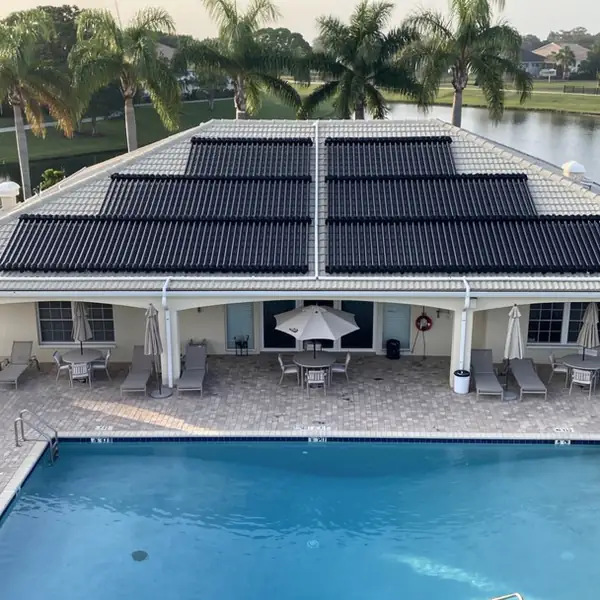 Community pool with solar array on clubhouse