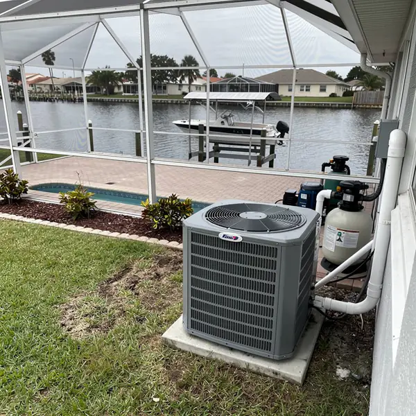 Pool heat pump beside canal home lanai