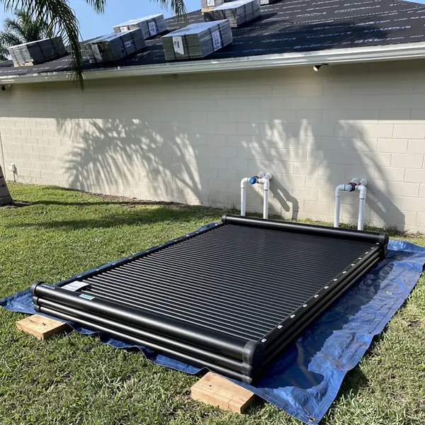 Removed pool solar panels stacked during re-roof