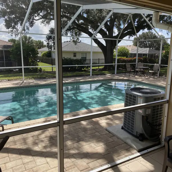 Shaded Cape Coral pool with heat pump