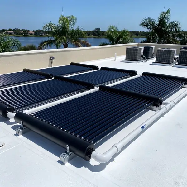 Solar pool collectors on flat roof racks